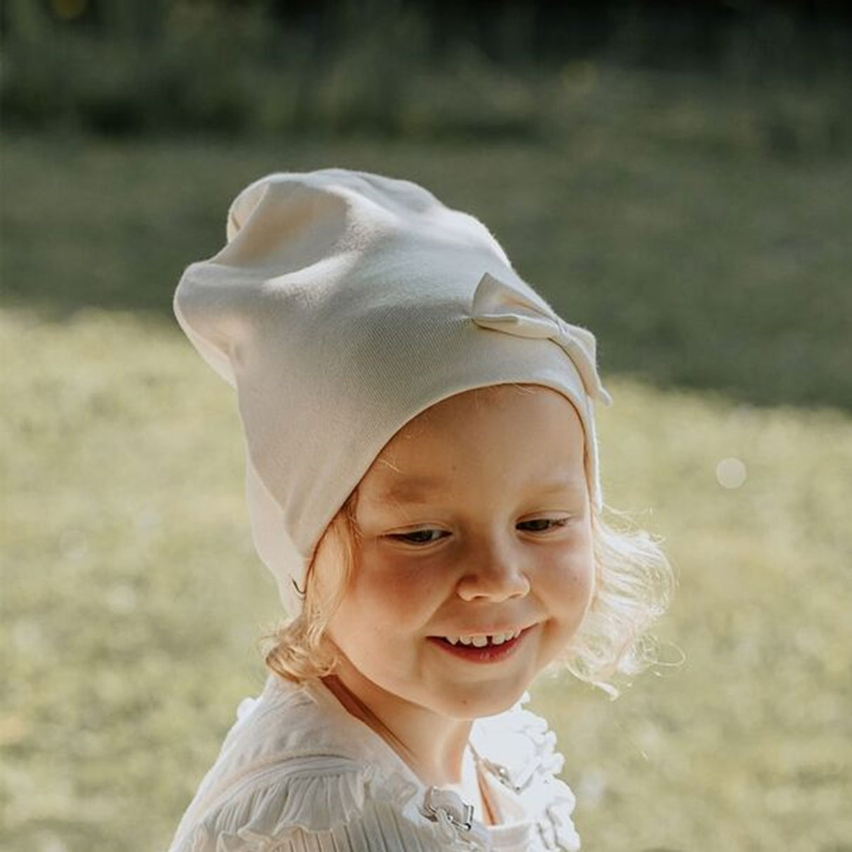 Racing Kids Mössa Vindtät 2-lagers Rosett Eggshell